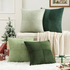 Green striped corduroy pillow covers arranged on bed with cozy decor