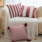 Red striped tassel pillow cover with farmhouse pattern and decorative fringe detail