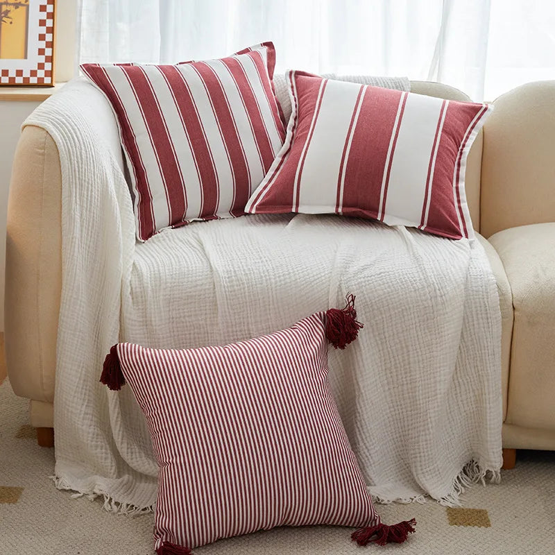 Red striped tassel pillow cover with farmhouse pattern and decorative fringe detail