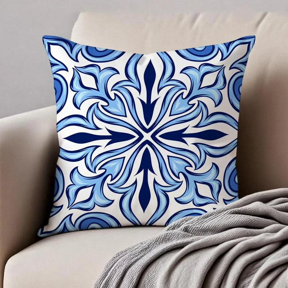 Decorative pillow with blue and white pattern on a beige couch