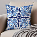 Decorative pillow with blue and white pattern on a beige couch