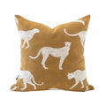Decorative pillow with white cheetah patterns on a mustard yellow background