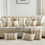 Beige sofa with patterned cushions in a living room setting