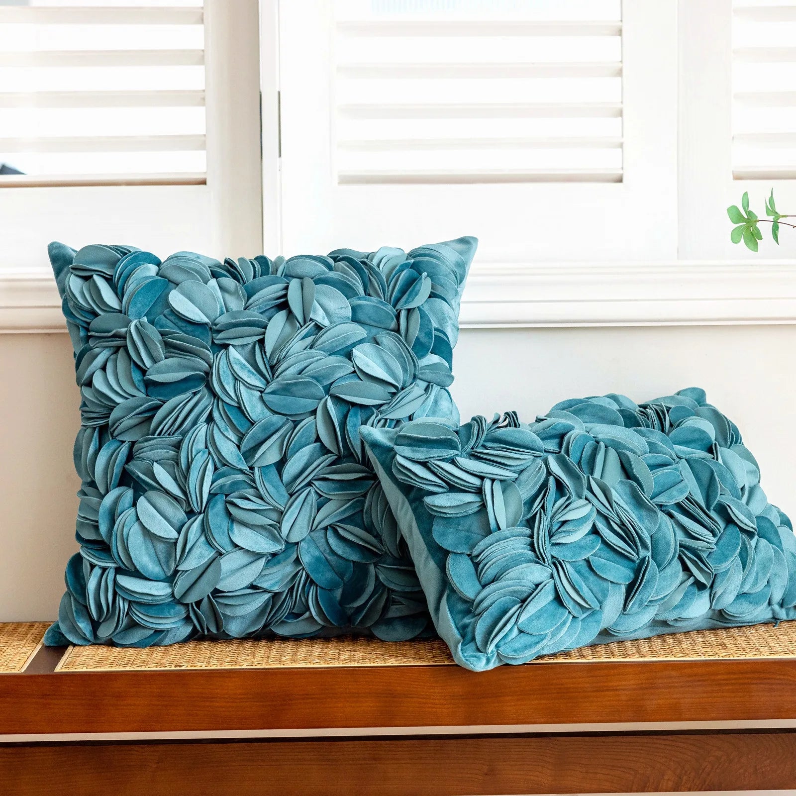 Blue luxury velvet pillow cover with floral petal embroidery and elegant textured design