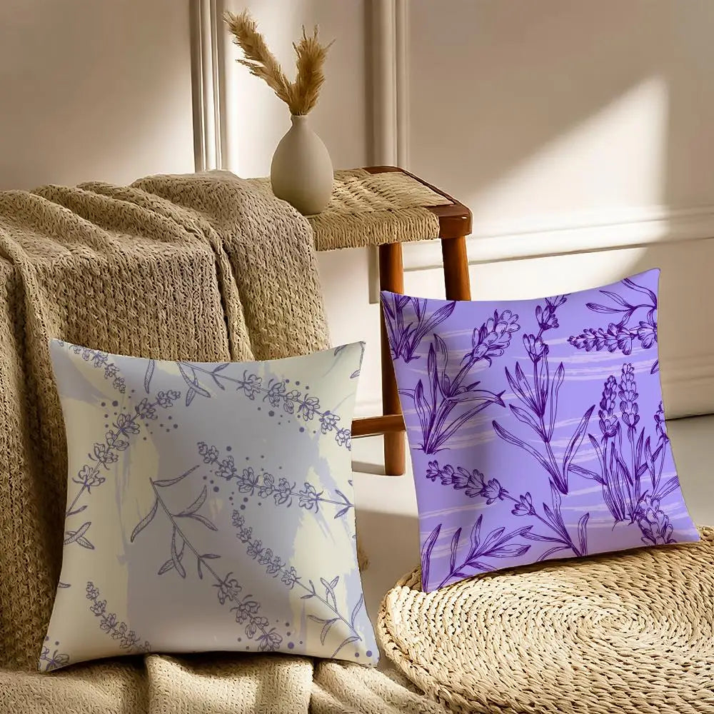 Two decorative pillows with floral patterns on a couch