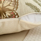 Close-up of a decorative pillow with floral patterns on a neutral background
