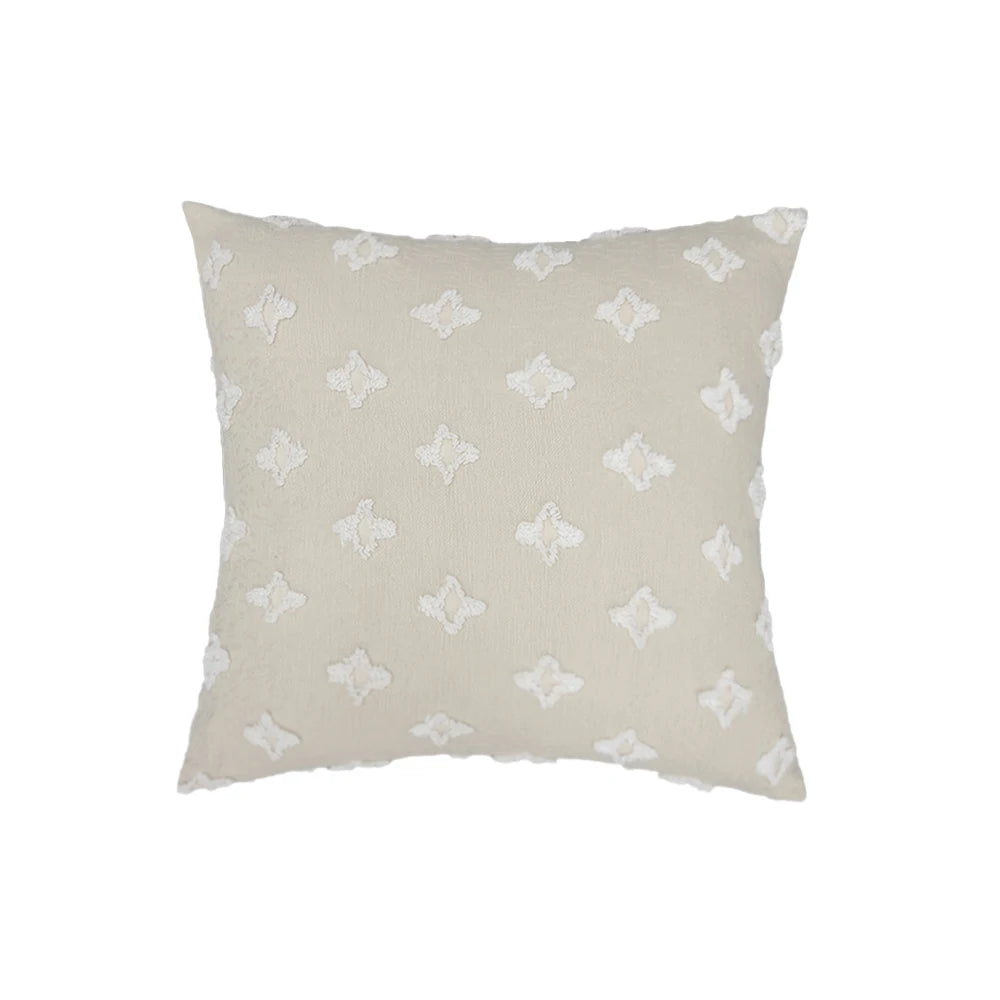 Beige pillow with white butterfly pattern on a white background