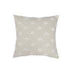 Beige pillow with white butterfly pattern on a white background