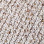 Close-up of textured boucle fabric with woven striped pattern detail
