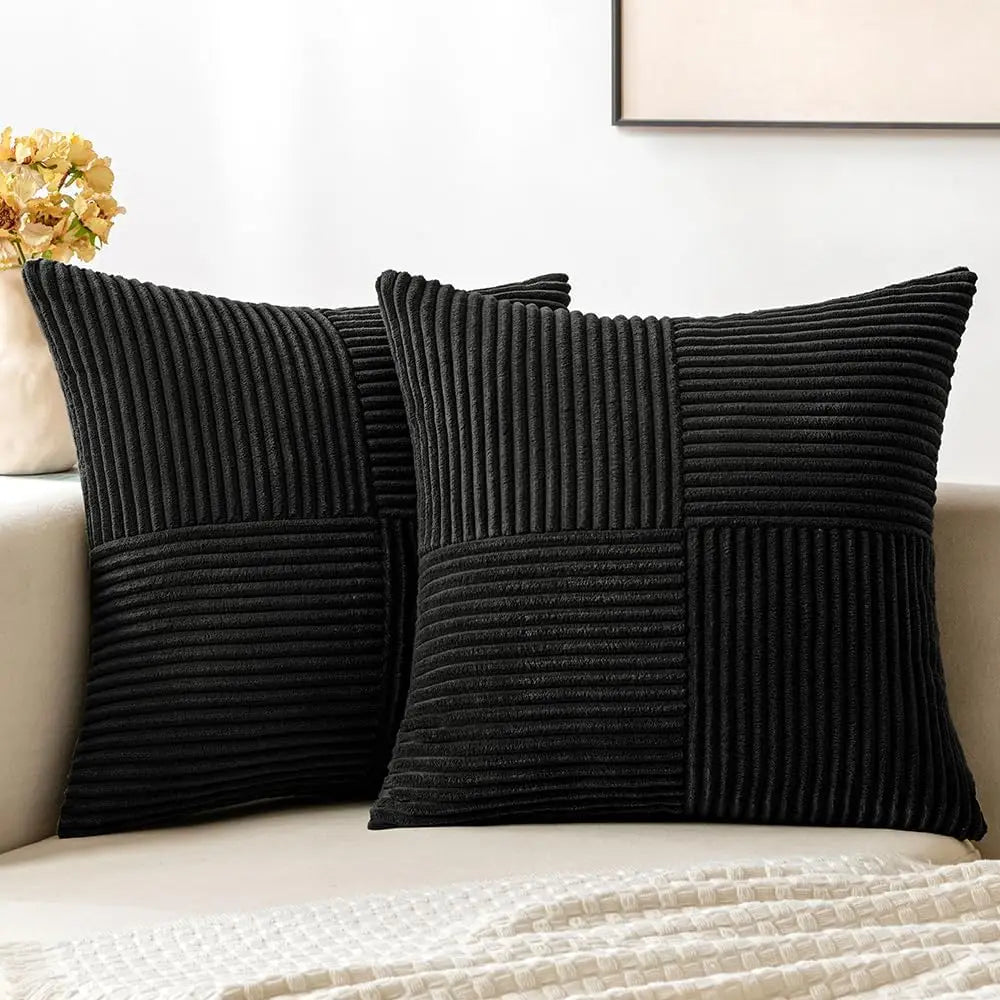 Black corduroy pillow covers with striped texture on sofa