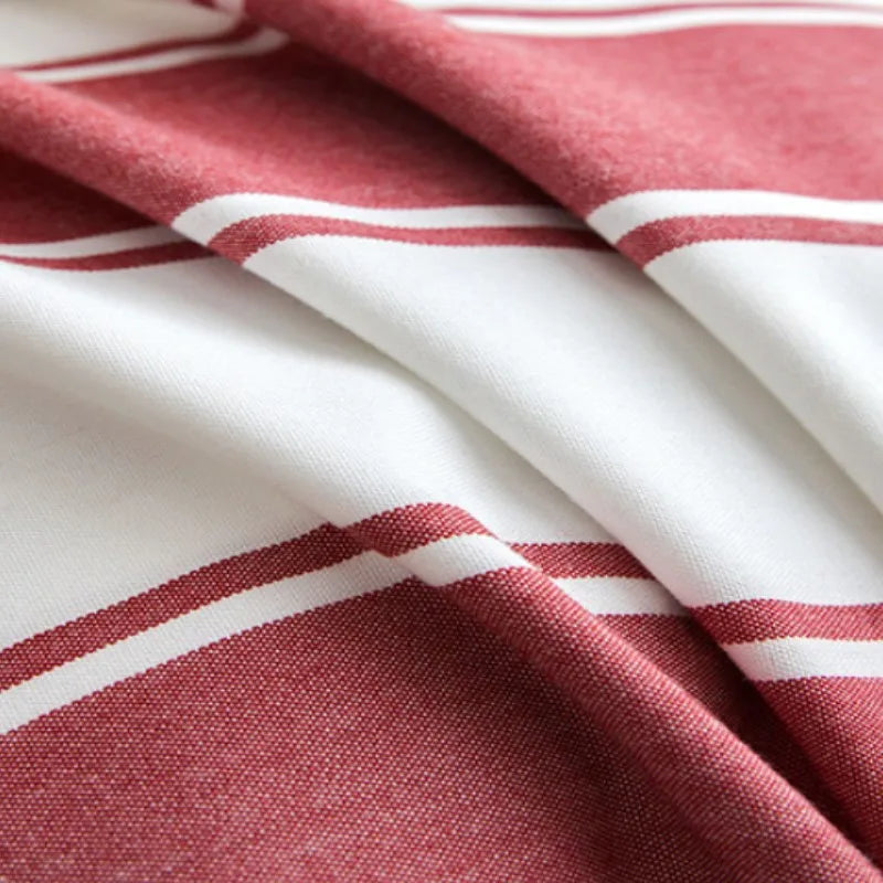 Red striped tassel pillow cover with farmhouse pattern and decorative fringe detail