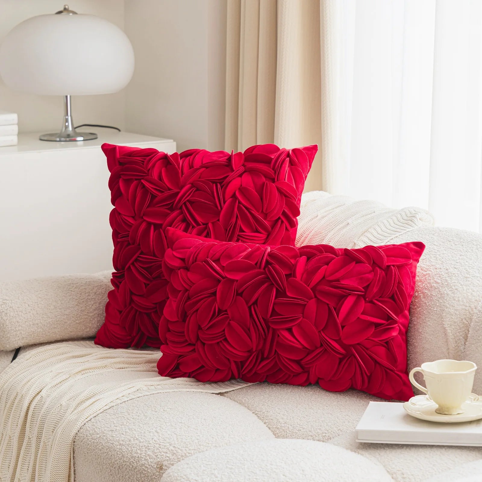 Red luxury velvet pillow cover with floral petal embroidery and elegant textured design