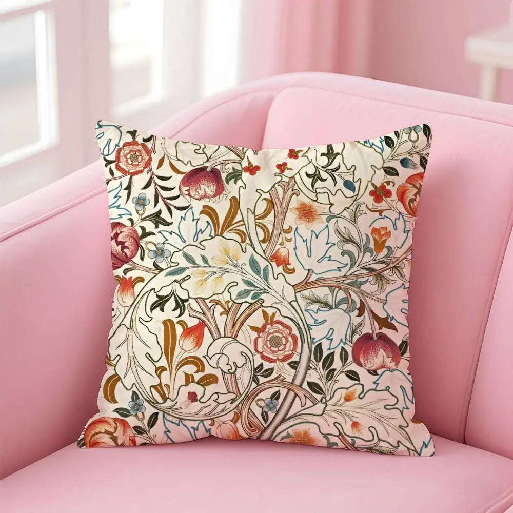Decorative pillow with floral pattern on a pink sofa
