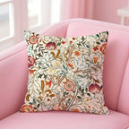 Decorative pillow with floral pattern on a pink sofa