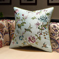Decorative pillow with floral embroidery on a couch