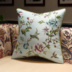 Decorative pillow with floral embroidery on a couch