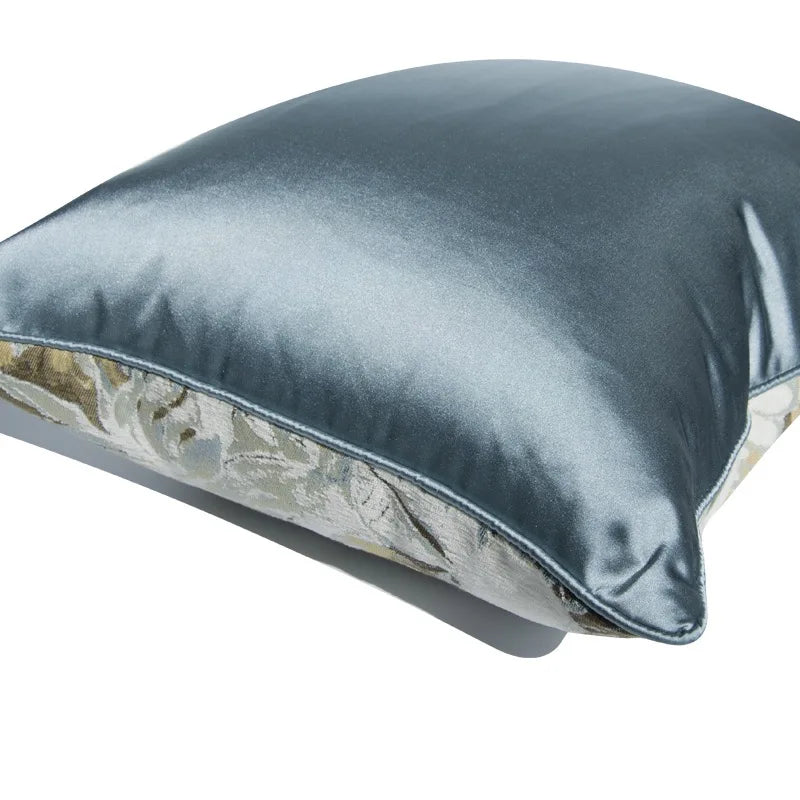 Gray pillow with floral pattern on a white background