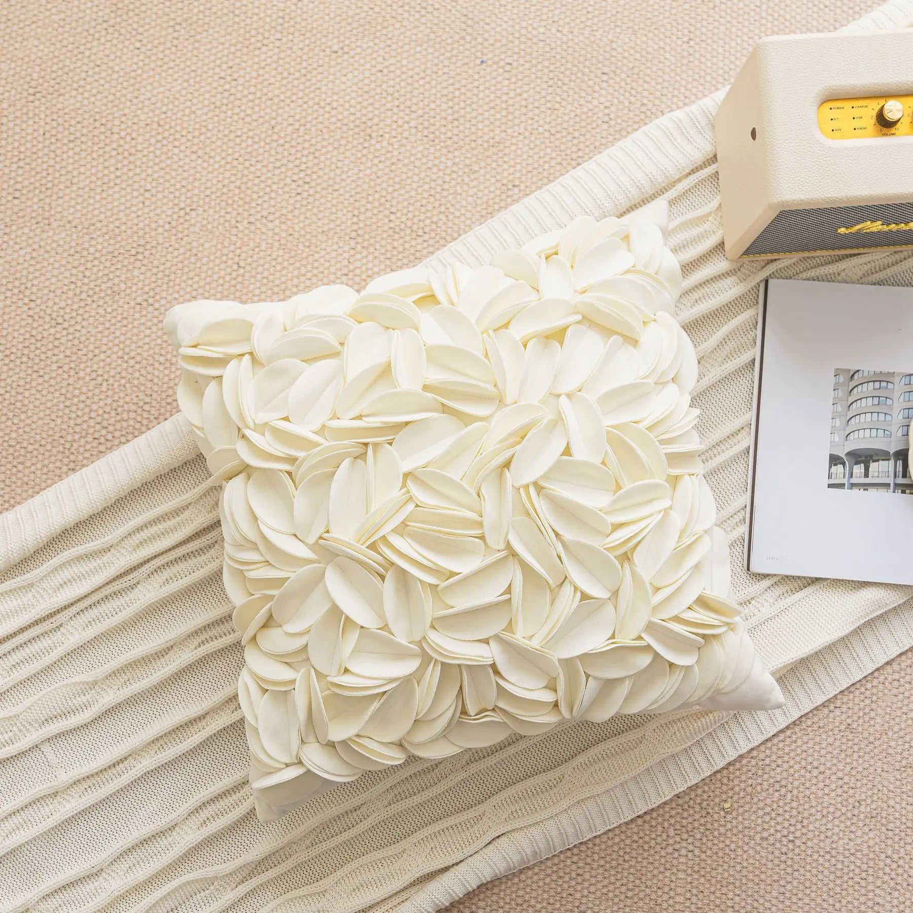 White luxury velvet pillow cover with floral petal embroidery and elegant textured design