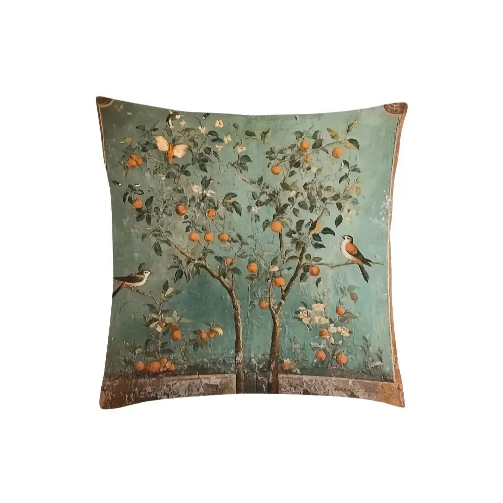 Decorative pillow with an orange tree and birds design on a green background