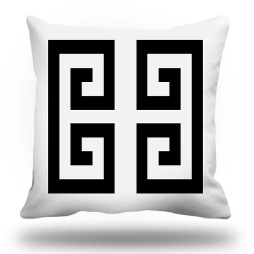 White pillow with black and white geometric pattern
