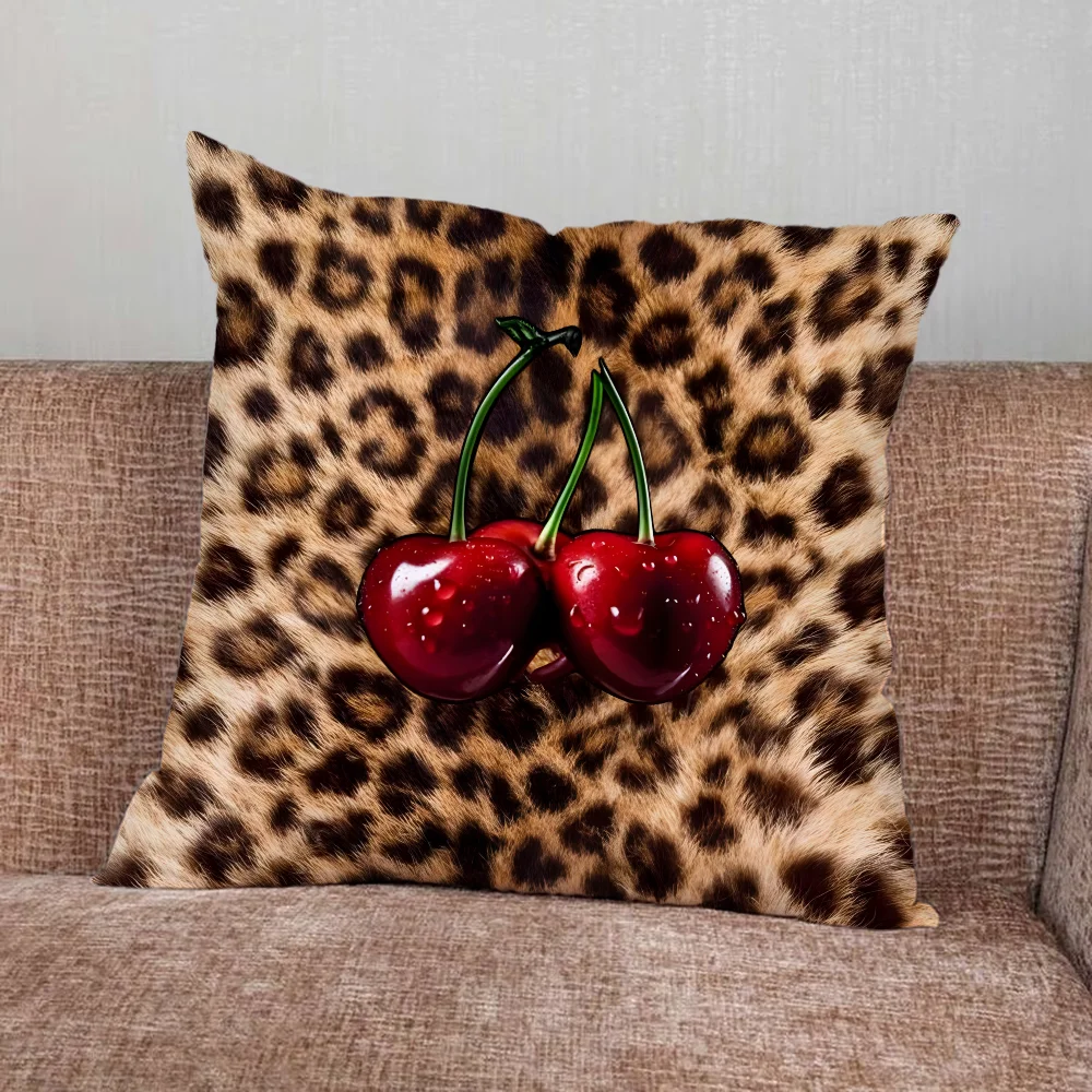 Leopard print pillow cover with cherry and star graphics in playful modern design