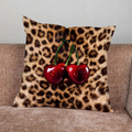 Leopard print pillow cover with cherry and star graphics in playful modern design