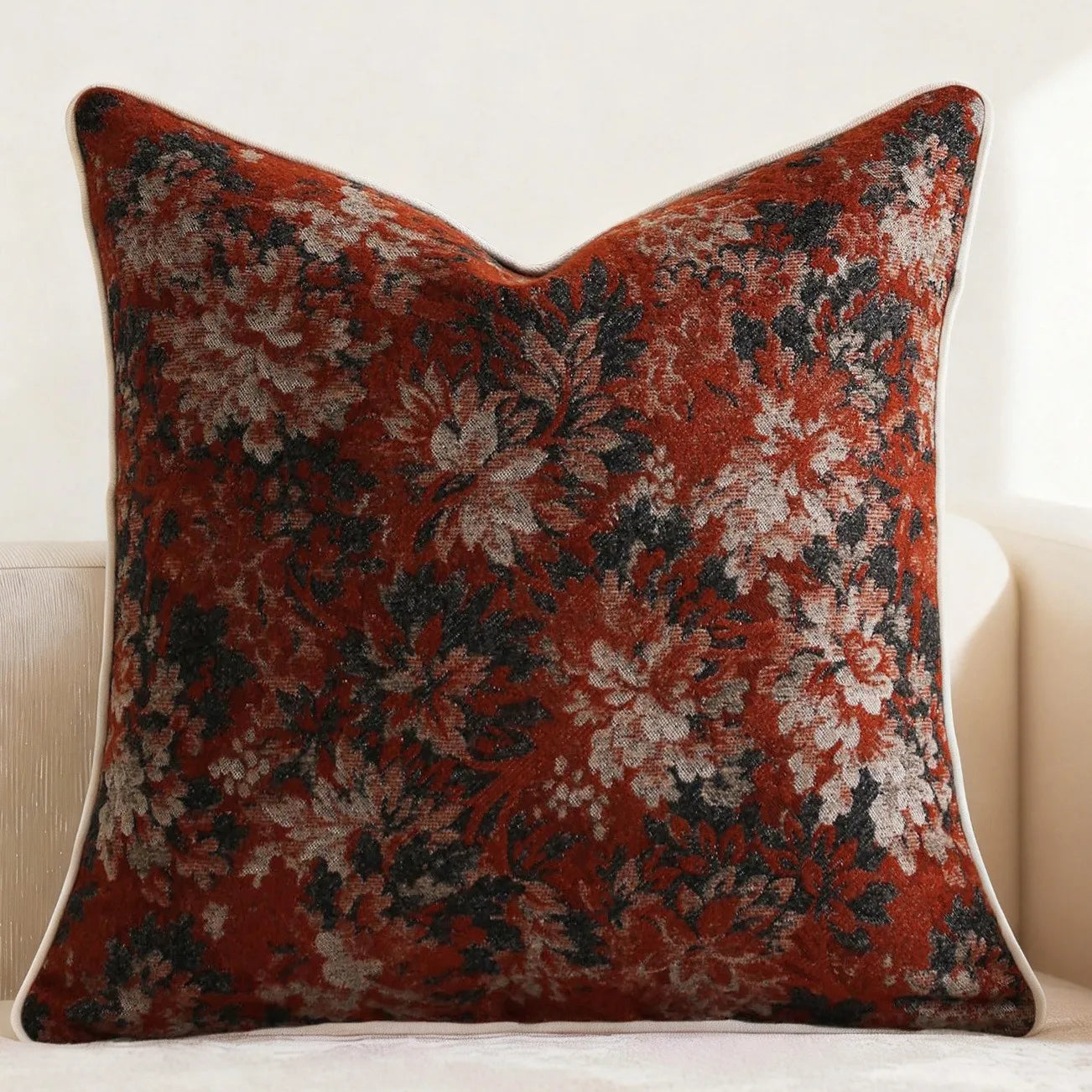 Decorative pillow with floral pattern on a white background