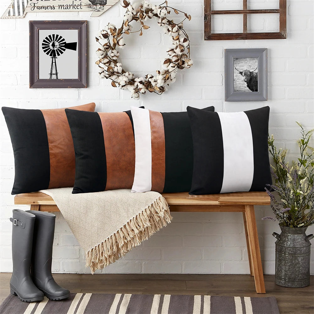 Decorative pillows on a bench with a wreath and boots in the background