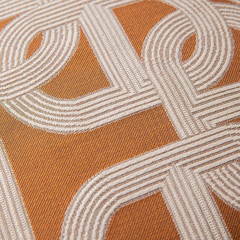 Close-up of a textured fabric with geometric pattern in brown and beige