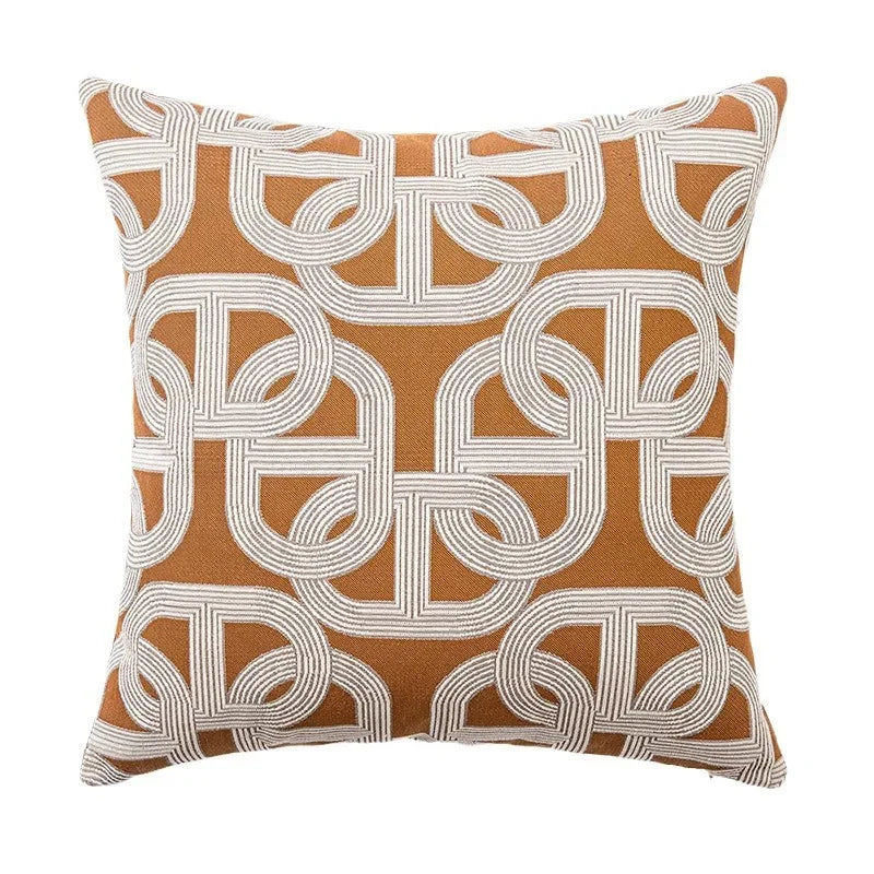 Decorative pillow with a brown and white geometric pattern 