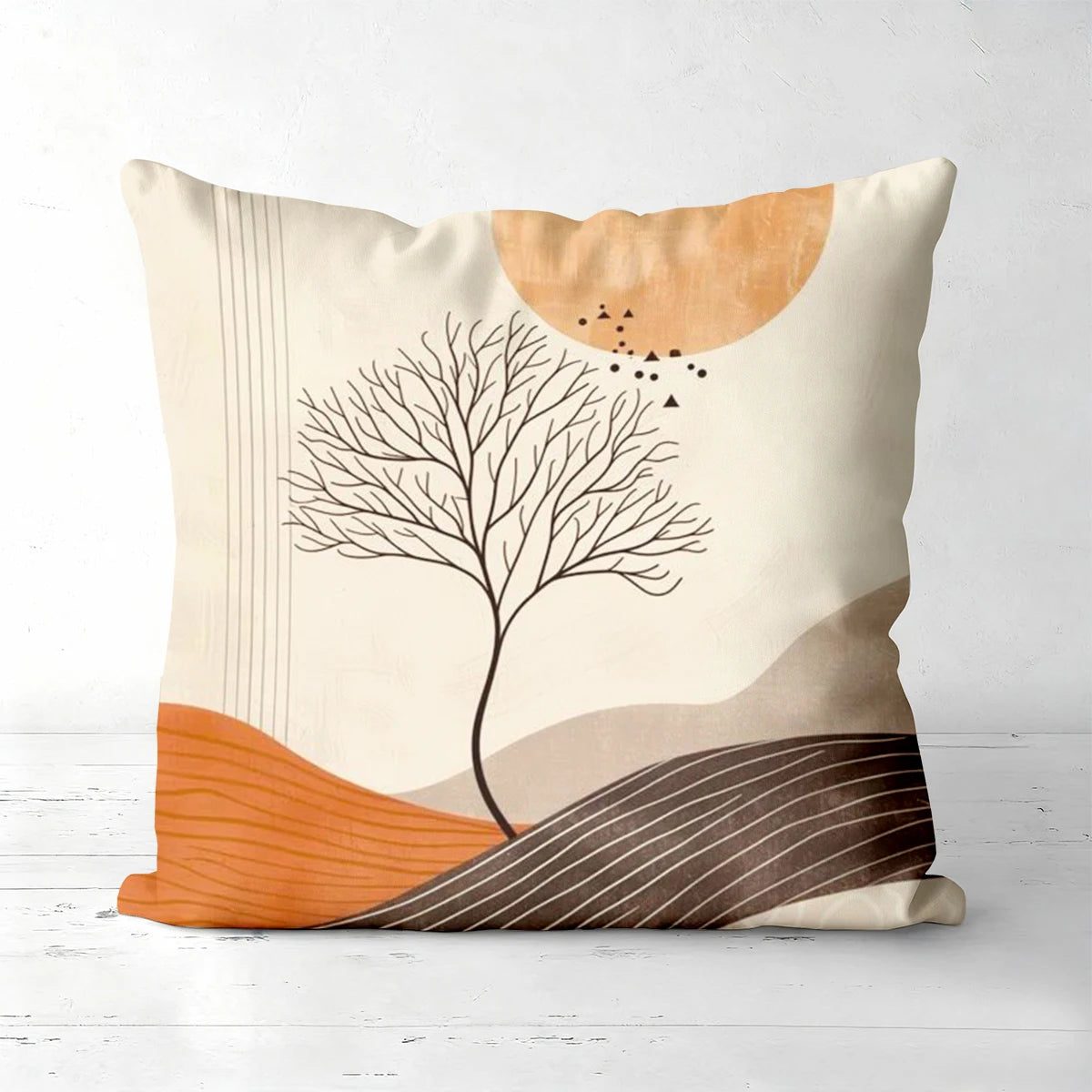Decorative pillow with abstract design of a tree and geometric shapes 