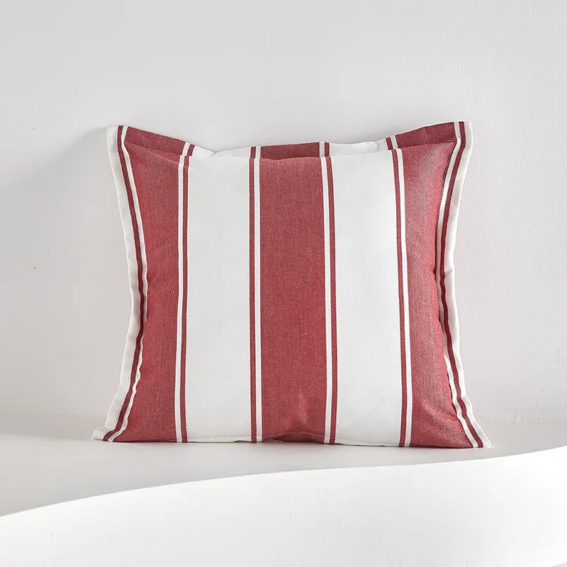 Red striped tassel pillow cover with farmhouse pattern and decorative fringe detail