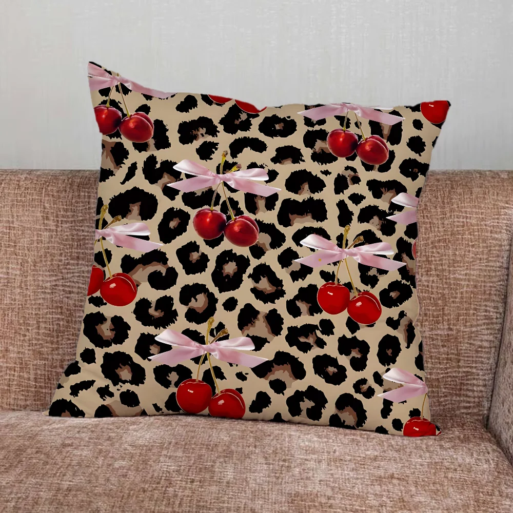 Leopard print pillow cover with cherry and star graphics in playful modern design