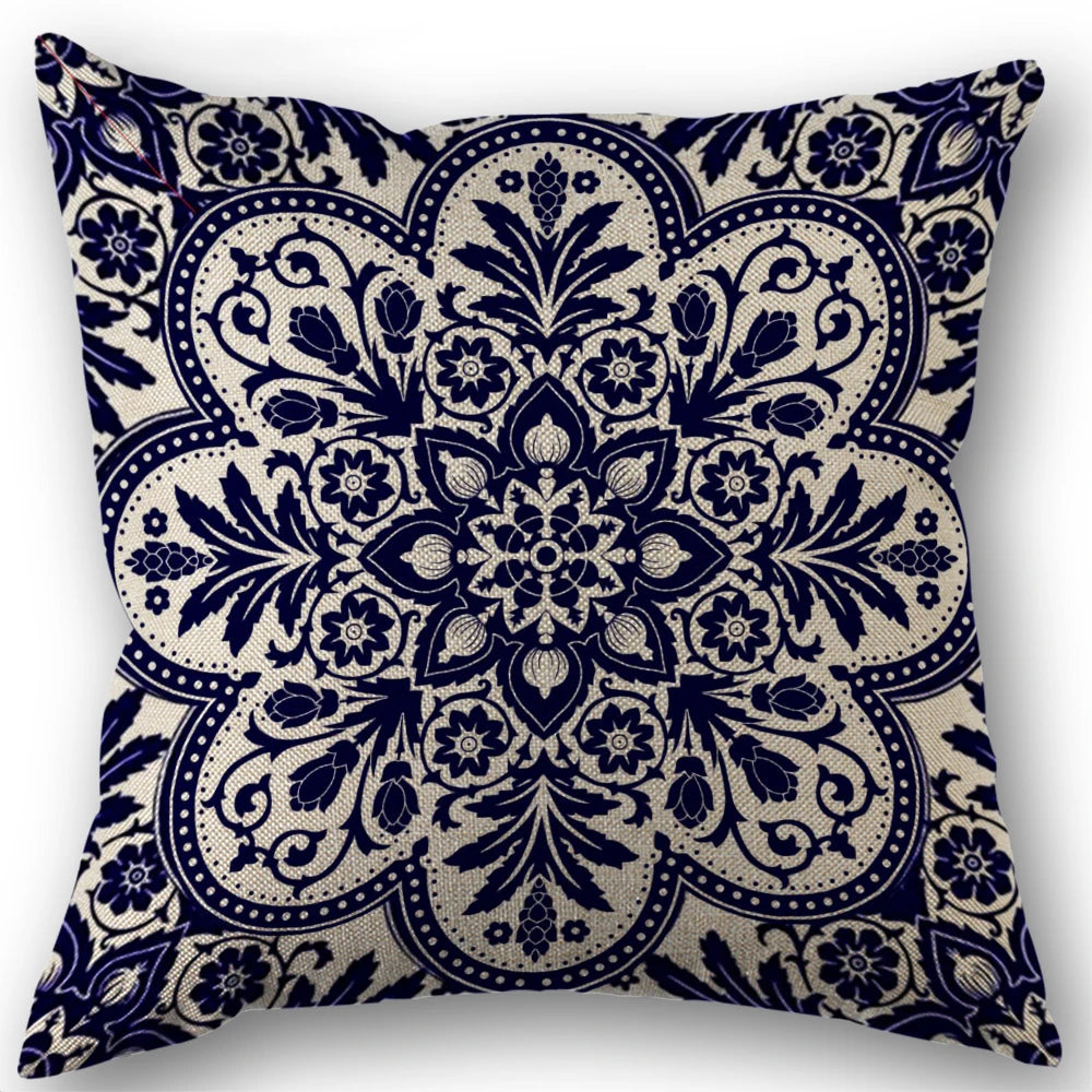 Decorative pillow with blue and beige floral pattern on a white background