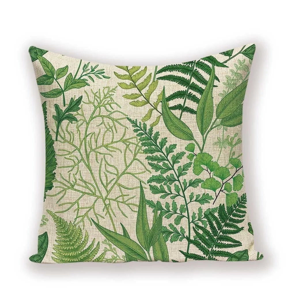 Pillow with green leaf pattern on a beige background