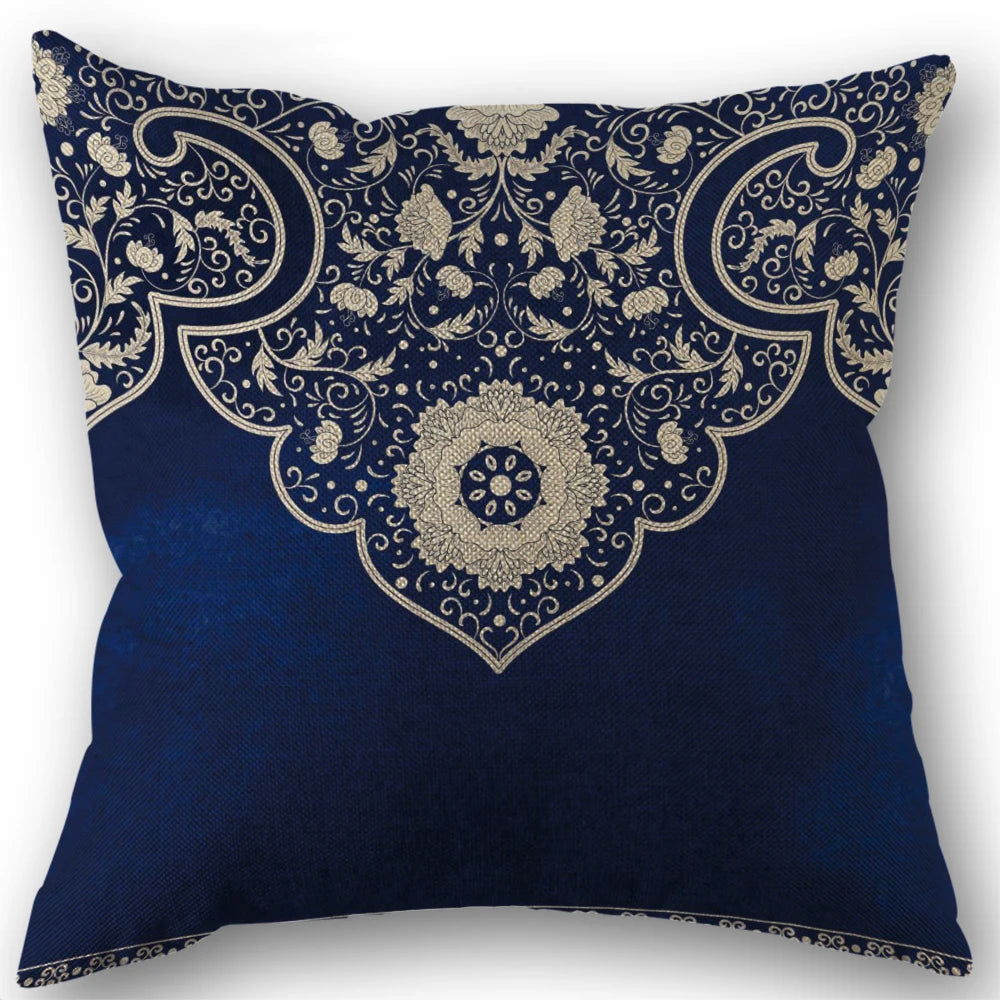 Decorative pillow with intricate paisley pattern on a blue background