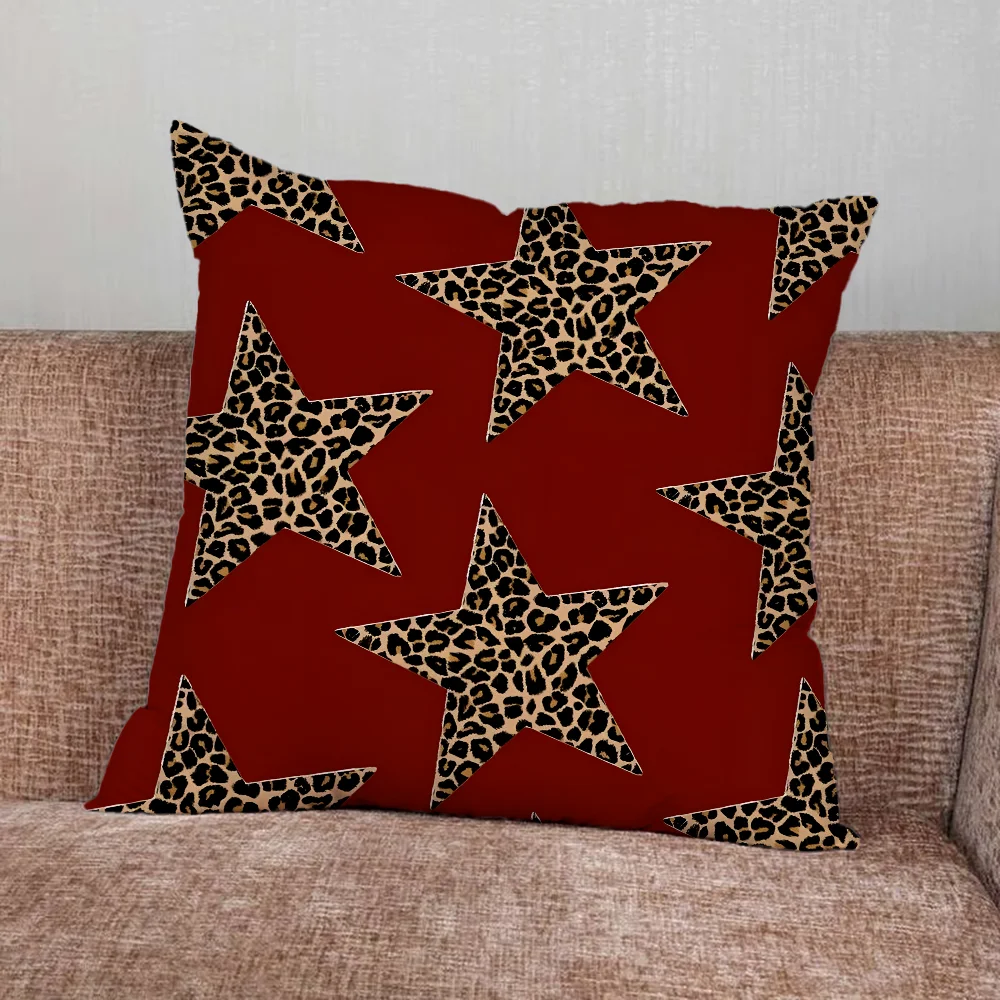 Leopard print pillow cover with cherry and star graphics in playful modern design