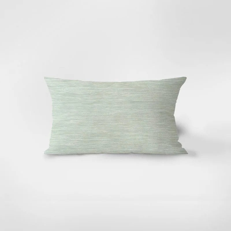 Rectangular green pillow on a white background