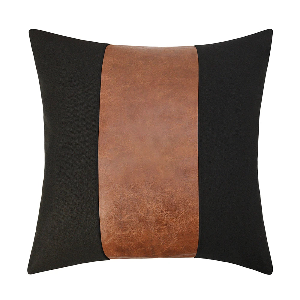 Decorative pillow with black and brown leather strip on a white background