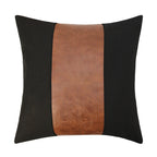 Decorative pillow with black and brown leather strip on a white background