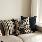 Retro leopard stripe pillow cover in brown and black with geometric animal print design