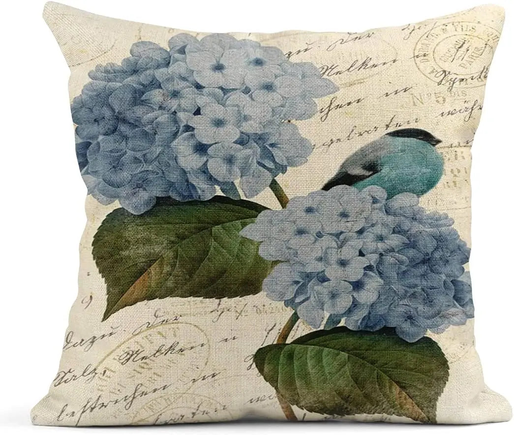 Decorative pillow with blue flowers and a bird on a beige background with text