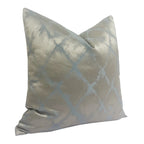 Decorative pillow with a silver and blue pattern on a white background