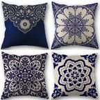 Four decorative pillows with blue and white floral patterns on a white background