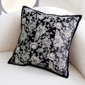 Decorative pillow with floral pattern on a white couch