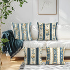 Decorative pillows with floral patterns on a white sofa in a living room setting.