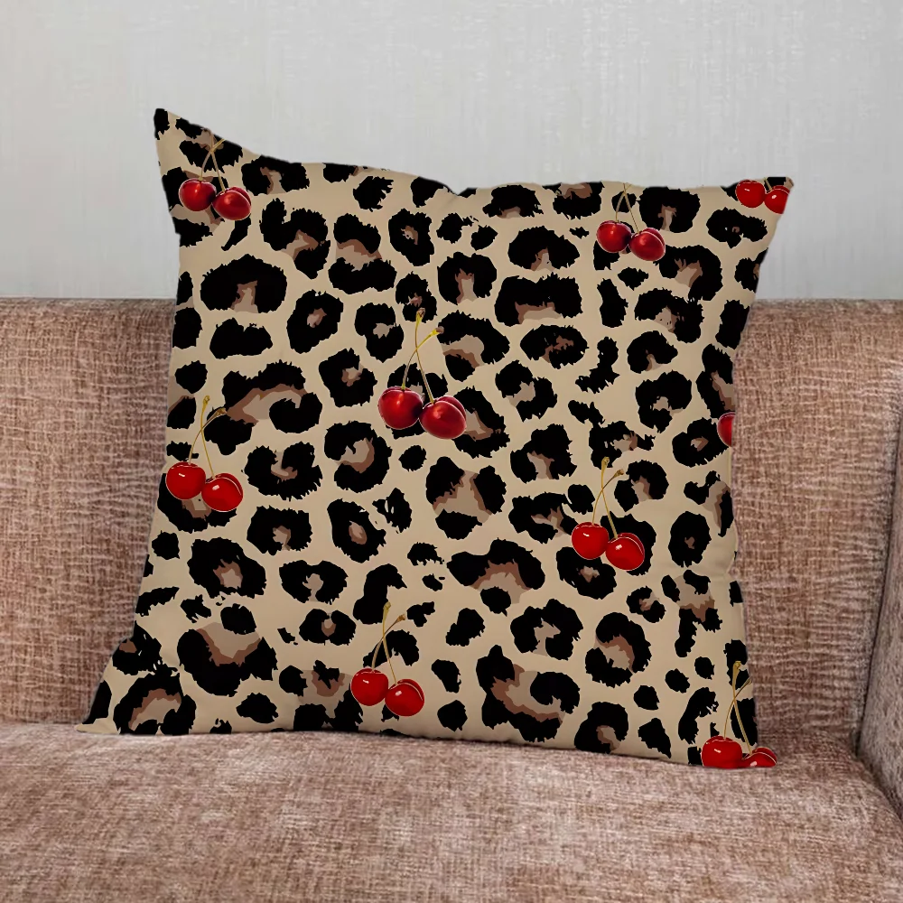 Leopard print pillow cover with cherry and star graphics in playful modern design