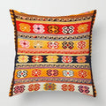 Decorative pillow with colorful geometric pattern on a white background