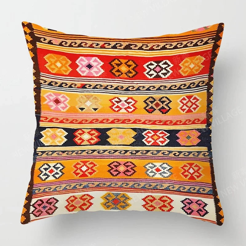 Decorative pillow with colorful geometric pattern on a white background