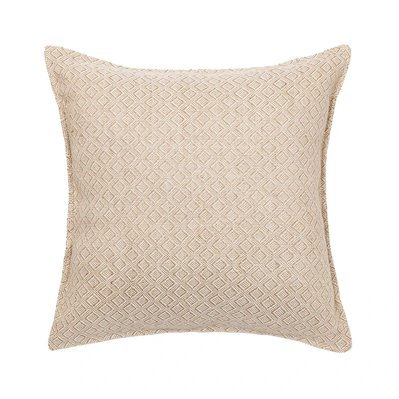 Beige textured pillow on a white background
